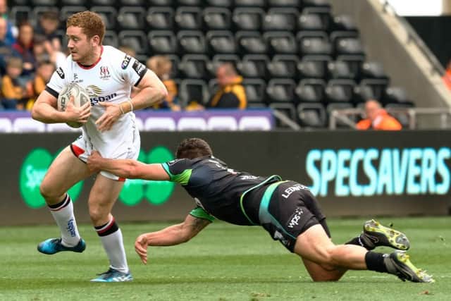 Ulster's Paddy Jackson is tackled by Kieron Fonotia of the Ospreys