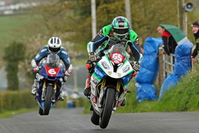 Michael Sweeney (BMW) leads William Dunlop (Yamaha) in the Cookstown 100 feature race.