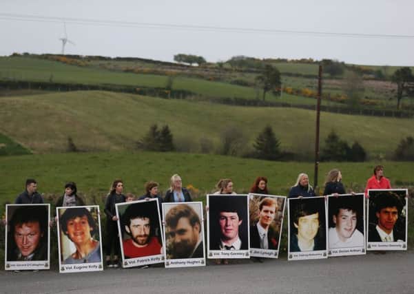 Photographs of the eight IRA members and bystander Anthony Hughes who were killed in an SAS ambush in Loughgall, Co Armagh, are held by people taking part in a march to Cappagh, Co Tyrone, commemorating the 30th anniversary of the shooting: Sunday April 30, 2017. The IRA members killed were Jim Lynagh, 32; Padraig McKearney, 32; Gerard O'Callaghan, 29; Tony Gormley, 25; Eugene Kelly, 25; Patrick Kelly, 32; Seamus Donnelly, 19; and Declan Arthurs, 21.