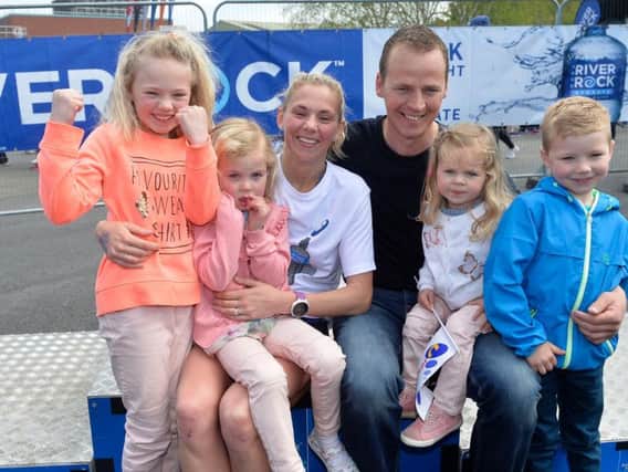 Women's race winner Laura Graham pictured with husband Thomas and children Leila, Darcy, Payton and Jaden after her Belfast Marathon win