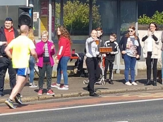 Belfast City Marathon runners were offered free beer on Antrim Road, Photo: Jordan Millar