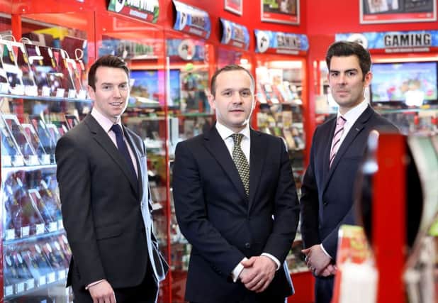Pictured in Cookstowns new CeX store are, from left, Lambert Smith Hamptons retail team of Tony Kernan, Gary Martin and Ryan Kee