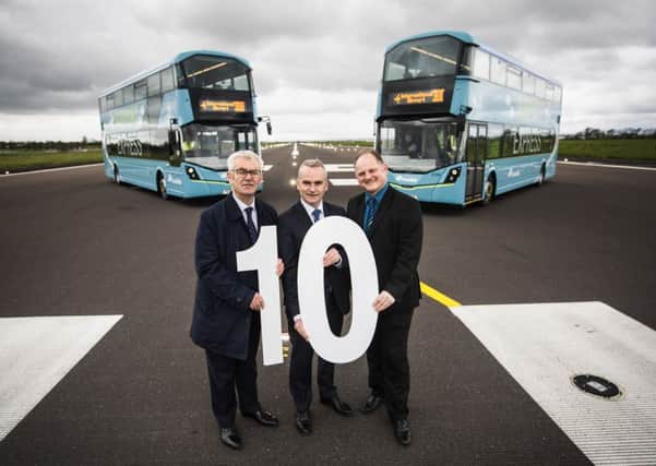 John McGrath, Deputy Secretary, Department for Infrastructure; Chris Conway, Group Chief Executive, Translink and Uel Hoey, Business Development Director Belfast International Airport at the launch of ten new state-of-the-art buses on the Airport Express 300 route from Belfast City Centre to Belfast International Airport representing investment of Â£2.3 million.