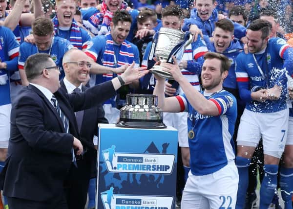 Linfields Jamie Mulgrew lifts the Danske Bank Premiership trophy