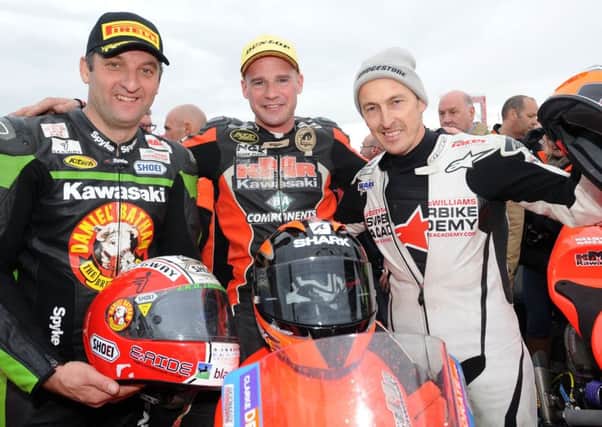 Michael Rutter with race winner Ryan Farquhar and Jeremy McWilliams at the 2012 North West 200 when Rutter finished third on the KMR Kawasaki in the Supertwins race.