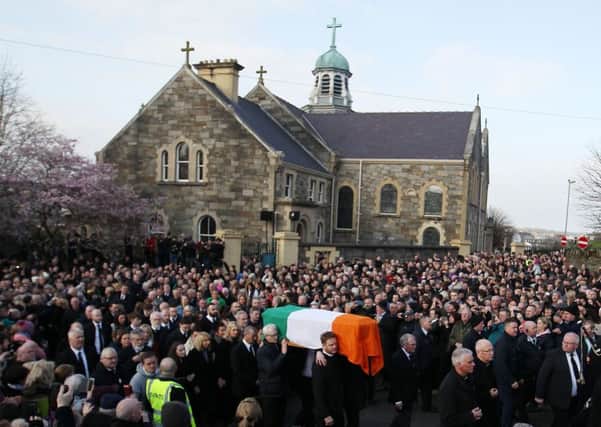 The Tricolour-draped coffin of Martin McGuinness is carried away from St Columba's Church in Londonderry after Requiem Mass for burial in the City Cemetery in March 2017. 

Picture by Jonathan Porter/PressEye.com
