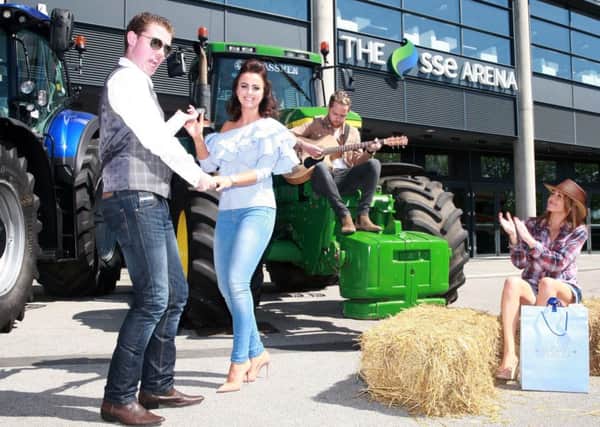 Ruairi McSorley, AKA, Frostbit Boy, got the party started at the launch of the Farmers Bash at the SSE Arena, Belfast, today as he showed country singing star Lisa McHugh and radio presenter Kirsty McMurray from Downtown Country a few jiving moves while Derek Ryan provides the musical accompaniment. The Farmer Bash will take place on October 6, 2017 at Belfast's prestigious SSE Arena featuring popular, high-caliber country music artists and professional production values on a thunderous purpose built stage. It's expected to attract thousands of Irish country music and country jiving fans from across Ireland and beyond to see their musical heroes perform at the country party of a lifetime. This ambitious event, sponsored by Newbridge Silverware, presented by LSFX Productions, will be the UK & Ireland's BIGGEST EVER indoor Country Music Dance. Tickets are on sale for the Farmers Bash from 10am on Saturday 6th May priced at ?28.00 and ?30.00 and available from www.ticketmaster.ie, www.ssearenabelfast.com Picture