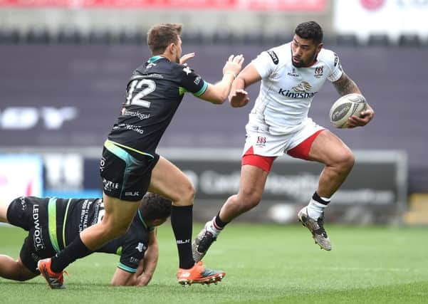 Charles Piutau of Ulster is tackled by Kieron Fonotia and Ashley Beck of Ospreys.