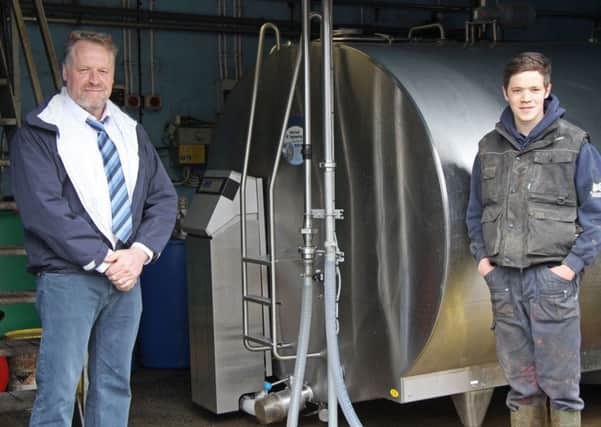 Mueller agent Cecil Wilson, Wilson Milk Tanks, discusses the benefits of the recently installed 14,000 litre HiPerForm milk cooler with Robert Chestnutt from Bushmills.