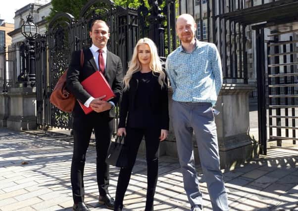Laura Lacole with her solicitor Ciaran Moynagh (left) and Boyd Sleator, Development Officer for Northern Ireland Humanists.