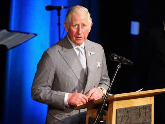 The Prince of Wales speaks to guests in the Helicon, a performance space, during a visit with the Duchess of Cornwall to the new centre in Bellaghy, dedicated to Seamus Heaney during their visit to Northern Ireland