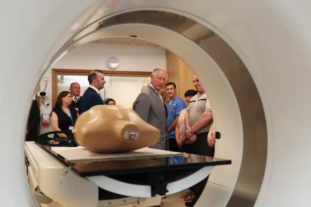 The Prince of Wales looks at a CT scanner during a tour of the North West Cancer Centre at Altnagelvin Hospital in Londonderry during their visit to Northern Ireland