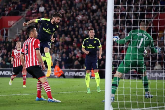 Arsenal's Olivier Giroud scores his side's second goal of the game during the Premier League match at St Mary's, Southampton. Photo: Nick Potts/PA Wire.