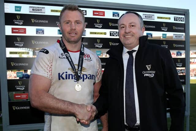 Ulster's Roger Wilson receives his man of the match medal from Colin Bell of Guinness