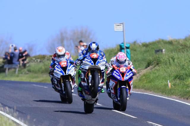 Ian Hutchinson (4, Tyco BMW), Lee Johnston (13, ECR BMW) and Alastair Seeley (34, Tyco BMW) in action on Thursday at the North West 200 during Superstock practice.