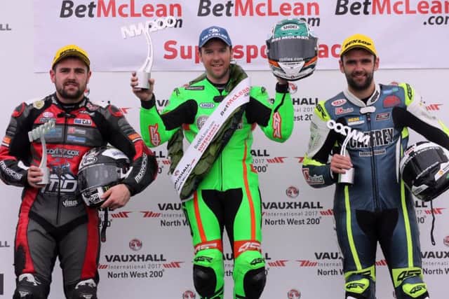 Supersport race winner Alastair Seeley with runner-up William Dunlop (right) and Michael Dunlop (left) on the podium at the North West 200.