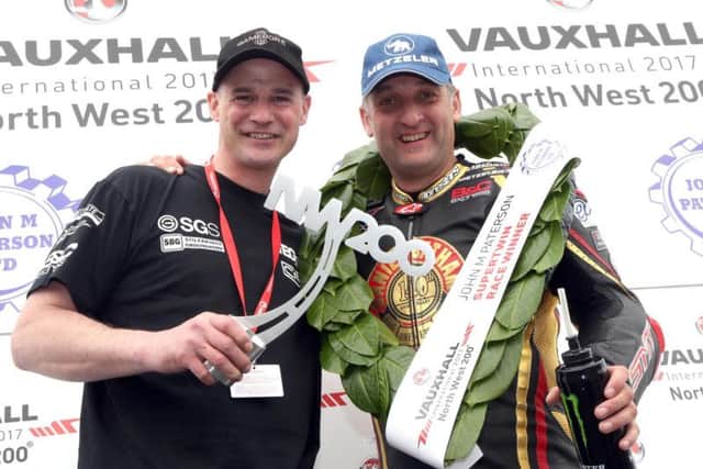Michael Rutter with KMR Kawasaki team owner Ryan Farquhar after his win in Saturday's Supertwins race at the North West 200.