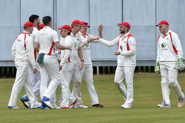 Waringstown players celebrate after Jordan McClerkin was caught out by Gary Kidd off Shaheen Khan. However, Instonians had the last laugh