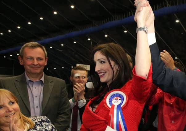 Richard Pengelly (left, in grey suit) applauding his wife, Emma Little-Pengelly, as she was elected an MLA last year