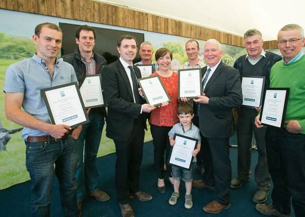 Pictured at the Dale Farm Milk Quality Improvement Awards at Balmoral Show are the full group of Dale Farm dairy farmers, awarded for their milk quality improvement.  Presenting the awards are Stephen Hughes, Ulster Bank and John Dunlop, Chairman, Dale Farm Group.