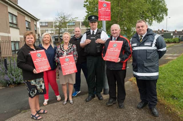 Highlighting the red notices iniative are, from left: Mid and East Antrim Policing and Community Safety Partnership Vice Chair Marjorie Hawkins; Wendy Kerr, independent member; the Mayor Councillor Audrey Wales MBE; Rodney Quigley, independent member (Harryville Partnership); PSNI Chief Inspector Stephen Humphries; Councillor Reuben Glover and Tommy Crawford, PCSP Community Safety Warden. INBT 20-799-CON
