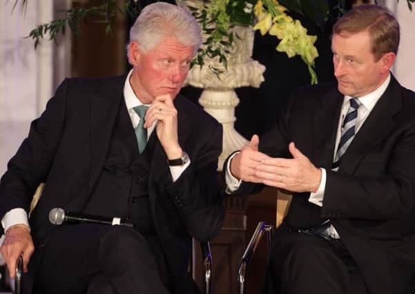 President Bill Clinton speaking with Taoiseach Enda Kenny at the Global Irish Economic Forum at Dublin Castle