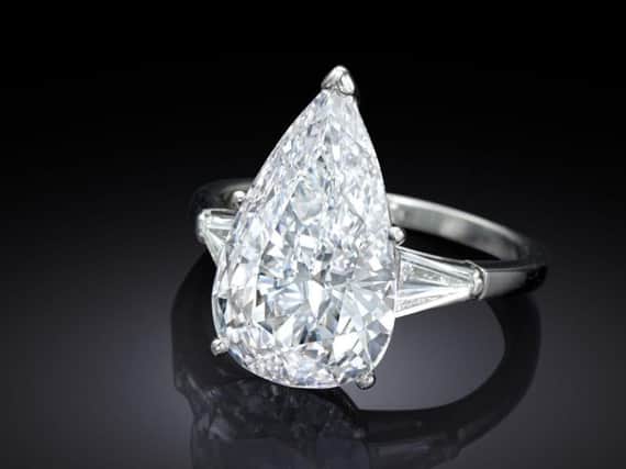 The diamond and platinum ring went under the hammer in a sale of the estate of best-selling author Jackie Collins (Bonhams/PA)