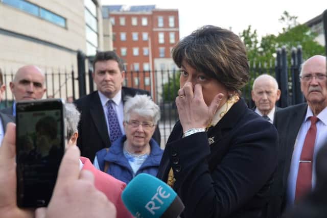 DUP Leader Arlene Foster outside with family and friends of those killed in the Kingsmill Massacre