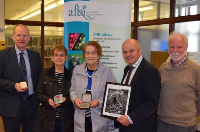 John Clarkes daughter, Miriam Hanna and niece, Rosemary McGarry, bring material for an exhibit to celebrate his achievements in potato breeding in Northern Ireland.