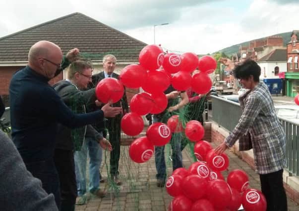 Sinn Feins MÃ¡irtÃ­n Ã“ Muilleoir (back) helped release several hundred balloons on Thursday in support of Saturdays rally