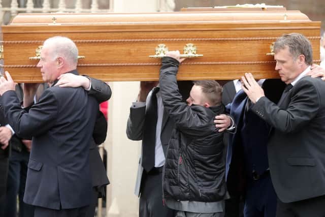 Concepta Leonard's 30-year-old son Conor, who has Down's syndrome,helps carry Mrs Leonard's coffin from St Mary's Church in Brookeborough after require mass. 

Picture by Jonathan Porter/PressEye.com
