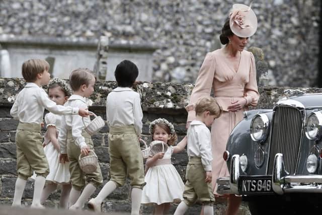 The Duchess of Cambridge with Prince George and Princess Charlotte with other page boys and flower girls outside St Mark's church in Englefield, Berkshire, following the wedding of Pippa Middleton and James Matthews. PRESS ASSOCIATION Photo. Picture date: Saturday May 20, 2017. See PA story ROYAL Pippa. Photo credit should read: Kirsty Wigglesworth/PA Wire