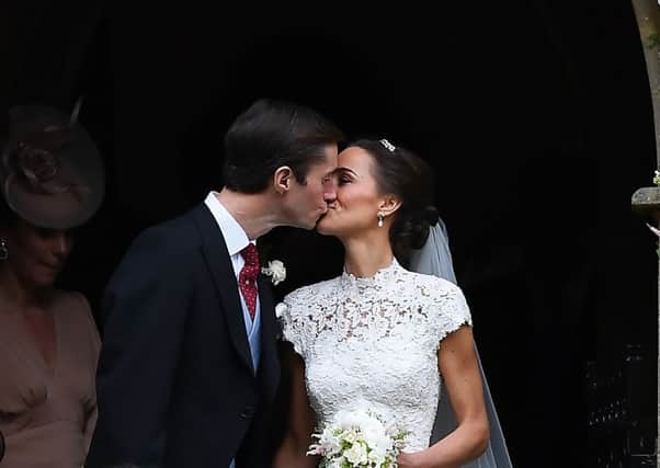 Pippa Middleton and her husband James Matthews kiss as they leave St Mark's church in Englefield, Berkshire, following their wedding. PRESS ASSOCIATION Photo. Picture date: Saturday May 20, 2017. See PA story ROYAL Pippa. Photo credit should read: Justin Tallis/PA Wire
