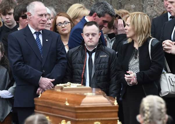 Mourners, including her son Conor (centre), at the funeral of Connie Leonard on Friday