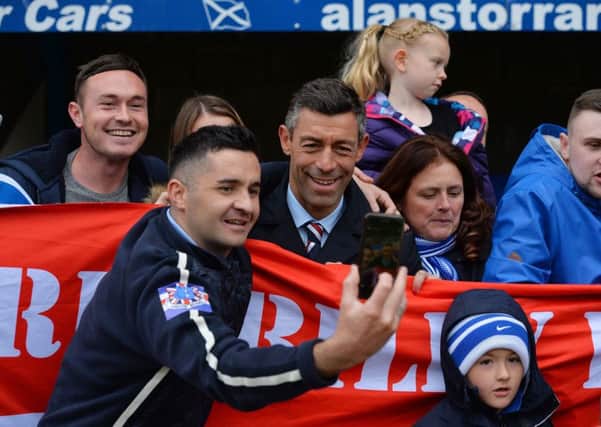 Rangers manager Pedro Caixinha is mobbed by fans after his sides 2-1 victory over St Johnstone