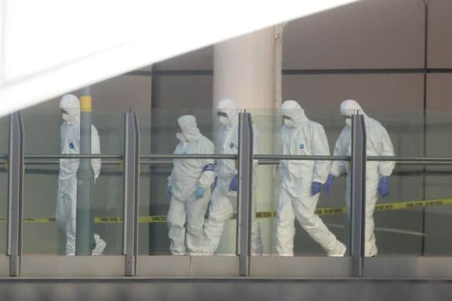 Forensic officers at the scene of the terror attack.