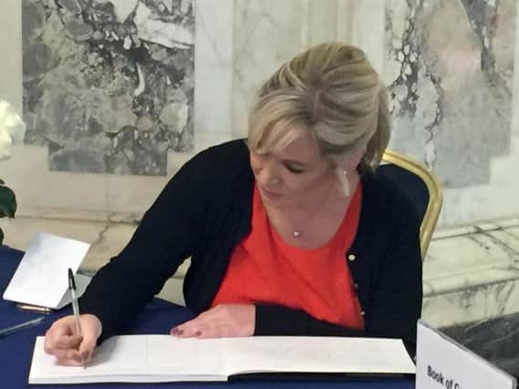 Sinn Fein leader in Northern Ireland Michelle O'Neill signs a book of condolence for Manchester victims at Belfast City Hall.