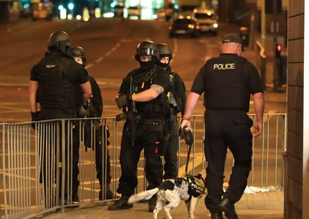 Armed police pictured after a suspected terrorist attack at the Manchester Arena