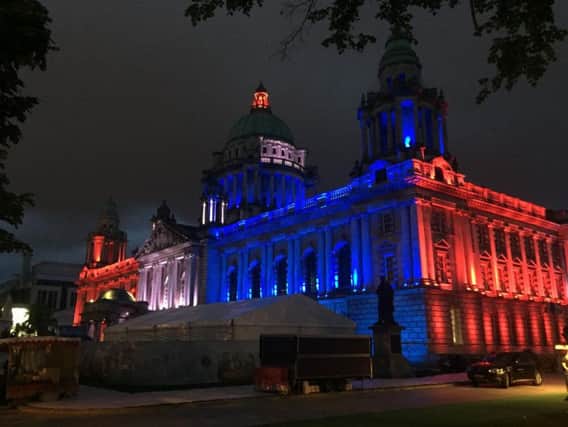 Belfast City Hall illuminated in the colours of Union flag after the Manchester concert bomb attack.
