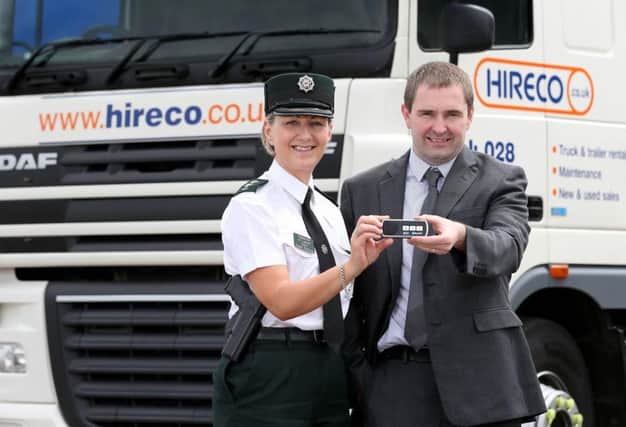 Inspector Rosie Leech from the PSNI Roads Policing Unit pictured with Ricky Graham, operations director with Hireco NI