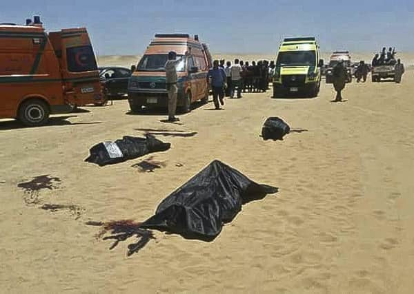 The aftermath of an attack in which gunmen stormed a bus in Minya, Egypt, Friday, May 26, 2017. Egyptian officials say dozens of people were killed and wounded in the attack by masked militants on a bus carrying Coptic Christians, including children, south of Cairo.  (Minya Governorate Media office via AP)