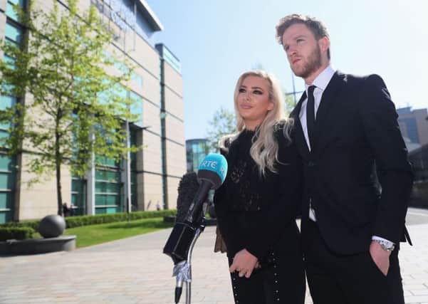 Model Laura Lacole and footballer Eunan O'Kane outside the High Court in Belfast, 26-05-17