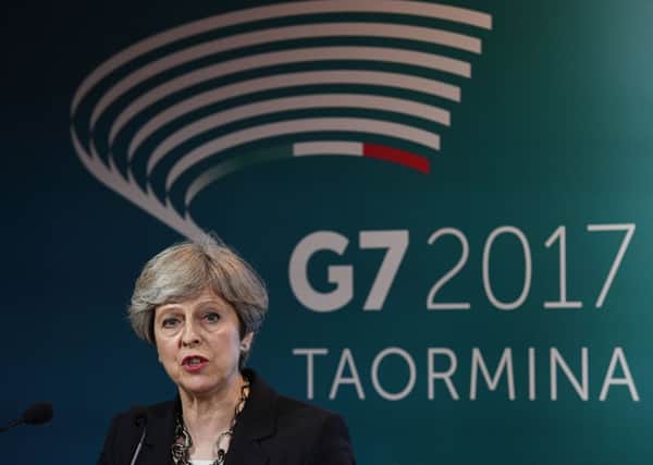Prime Minister Theresa May speaks during a press conference at the G7 summit at Teatro Greco in Taormina, Sicily, Italy. PRESS ASSOCIATION Photo. Picture date: Thursday May 25, 2017. See PA story POLITICS G7. Photo credit should read: Stefan Rousseau/PA Wire