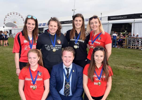 Pictured are the team from Gleno Valley YFC who were crowned senior champions coming first in the YFCUs girls football final held at Balmoral Show 2017. Congratulating the girls on their achievement is YFCU president James Speers