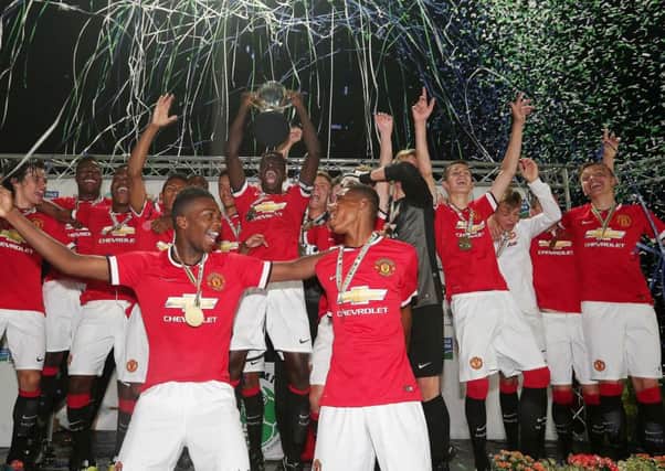Manchester United celebrate after winning the Dale Farm Milk Cup for a fifth time