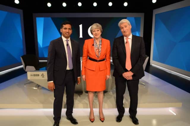 Prime Minister Theresa May with Jeremy Paxman (right) and Sky News political editor Faisal Islam