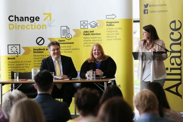 Party leader Naomi Long (centre) and deputy leader Stephen Farry at the launch of the Alliance Party manifesto
