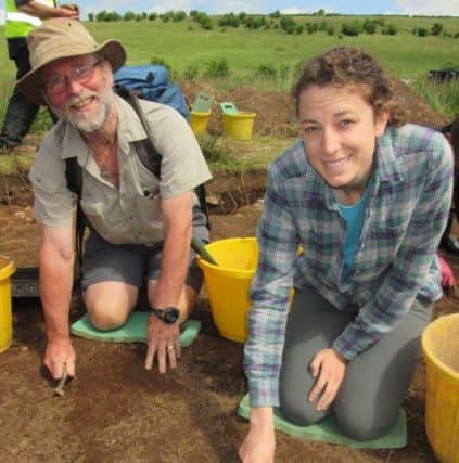 Volunteers Cormac Hamill and Krista Leibensperger giving a hand at last year's archeological dig