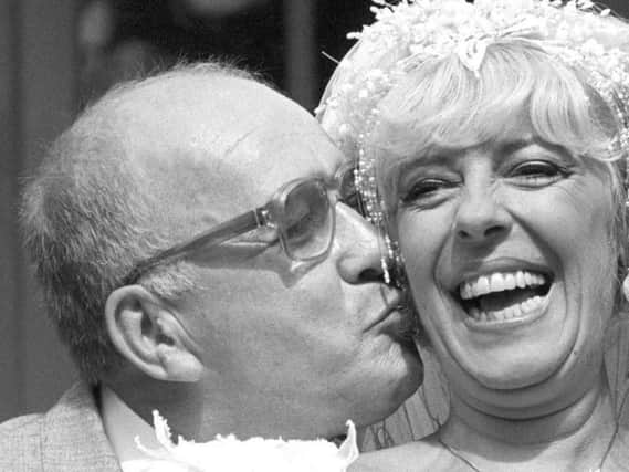 File photo dated 17/08/87 of Coronation Street barmaid Bet Lynch (actress Julie Goodyear) getting a kiss from television groom Alec Gilroy (actor Roy Barraclough)