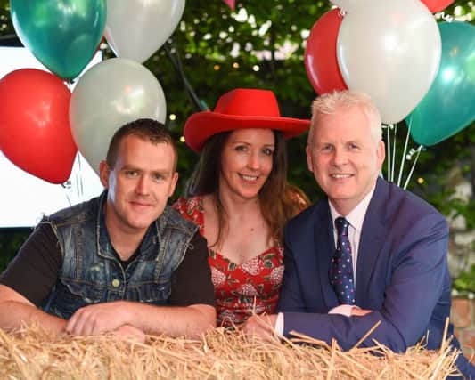 Singer Marty Mone joins Bronagh Henderson and Paddy Doody from Henderson Group to launch the new Your Community Supermarket